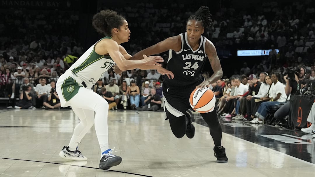 Sep 14, 2025; Las Vegas, Nevada, USA; Las Vegas Aces guard Jewell Loyd (24) drives against Seattle Storm guard Skylar Diggins (4) in the second quarter during game one of round one for the 2025 WNBA Playoffs at Michelob Ultra Arena. Mandatory Credit: Candice Ward-Imagn Images