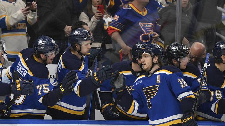 Apr 27, 2025; St. Louis, Missouri, USA; St. Louis Blues center Robert Thomas (18) is congratulated by teammates after scoring a goal against the Winnipeg Jets during the third period in game four of the first round of the 2025 Stanley Cup Playoffs at Enterprise Center. Mandatory Credit: Jeff Le-Imagn Images