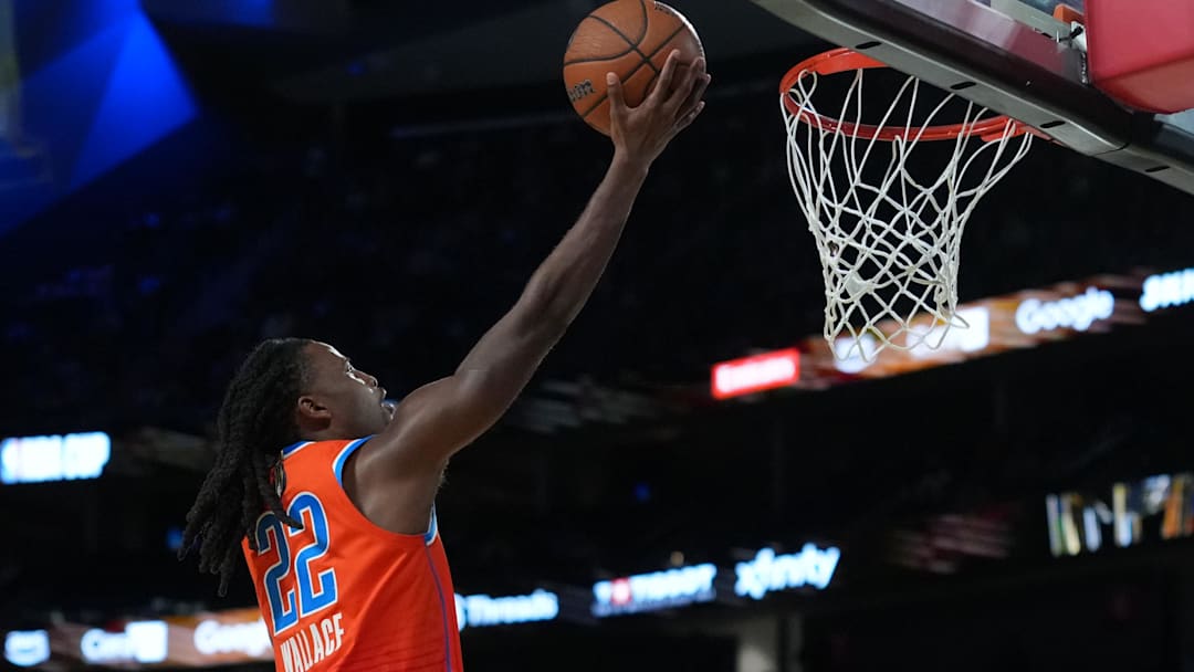 Dec 13, 2025; Las Vegas, Nevada, USA; Oklahoma City Thunder guard Cason Wallace (22) goes in for the lay up against the San Antonio Spurs during the second quarter at T-Mobile Arena. Mandatory Credit: Kirby Lee-Imagn Images
