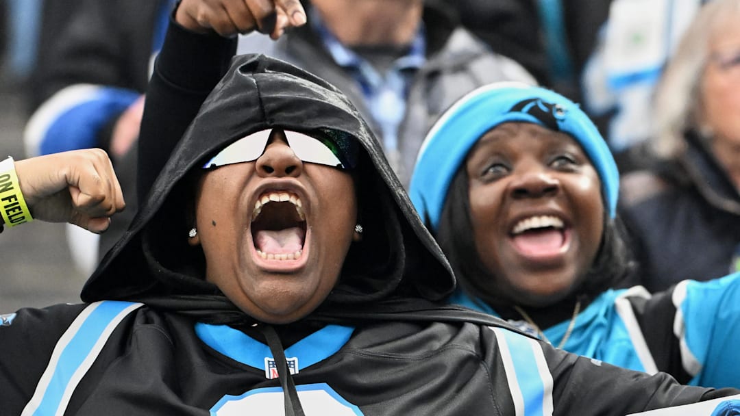 Carolina Panthers fans cheer for their team against the Seattle Seahawks. Carolina Panthers fans cheer for their team against the Seattle Seahawks.