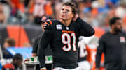 Cincinnati Bengals defensive end Trey Hendrickson (91) watches a replay as the Detroit Lions celebrate a touchdown in the fourth quarter of the NFL Week 5 game between the Cincinnati Bengals and the Detroit Lions at Paycor Stadium in downtown Cincinnati on Sunday, Oct. 5, 2025. The Bengals continued a losing streak, falling 37-24 to the Lions.