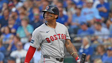 Aug 5, 2024; Kansas City, Missouri, USA;  Boston Red Sox third baseman Rafael Devers (11) walks back to the dugout after striking out in the first inning against the Kansas City Royals at Kauffman Stadium. Mandatory Credit: Peter Aiken-Imagn Images