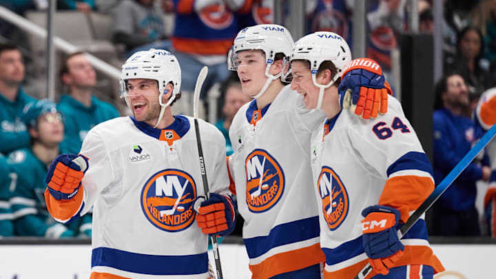 Mar 7, 2026; San Jose, California, USA; New York Islanders defenseman Tony DeAngelo (77) celebrates with defenseman Matthew Schaefer (48) and center Calum Ritchie (64) after scoring a goal against the San Jose Sharks during the first period at SAP Center at San Jose. Mandatory Credit: Robert Edwards-Imagn Images