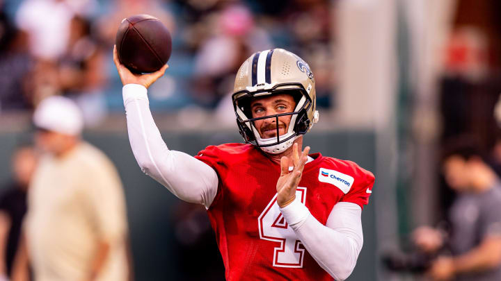 Aug 20, 2024; New Orleans, LA, USA;  New Orleans Saints quarterback Derek Carr (4) passes during practice at Yulman Stadium (Tulane). Mandatory Credit: Stephen Lew-USA TODAY Sports