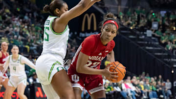 Indiana guard Chloe Moore-McNeil looks for room to move under cover from Oregon guard Deja Kelly as the Oregon Ducks host the Indiana Hoosiers Friday, Jan. 24, 2025, at Matthew Knight Arena in Eugene, Ore.
