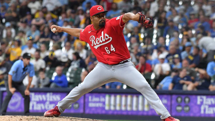 Cincinnati Reds relief pitcher Tony Santillan (64) delivers a pitch.