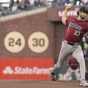 Sep 4, 2024; San Francisco, California, USA;  Arizona Diamondbacks pitcher Zac Gallen (23) pitches during the first inning against the San Francisco Giants at Oracle Park. Mandatory Credit: Stan Szeto-Imagn Images