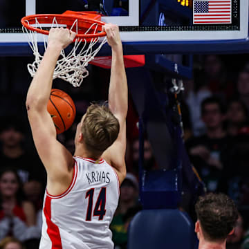 Dec 7, 2024; Tucson, Arizona, USA; Arizona Wildcats center Motiejus Krivas (14) dunks the ball during the first half against the Southern Utah Thunderbirds at McKale Center. Mandatory Credit: Aryanna Frank-Imagn Images