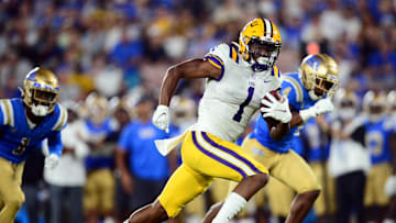 Sep 4, 2021; Pasadena, California, USA; Louisiana State Tigers wide receiver Kayshon Boutte (1) runs the ball for a touchdown against the UCLA Bruins during the second half the at the Rose Bowl. Mandatory Credit: Gary A. Vasquez-Imagn Images