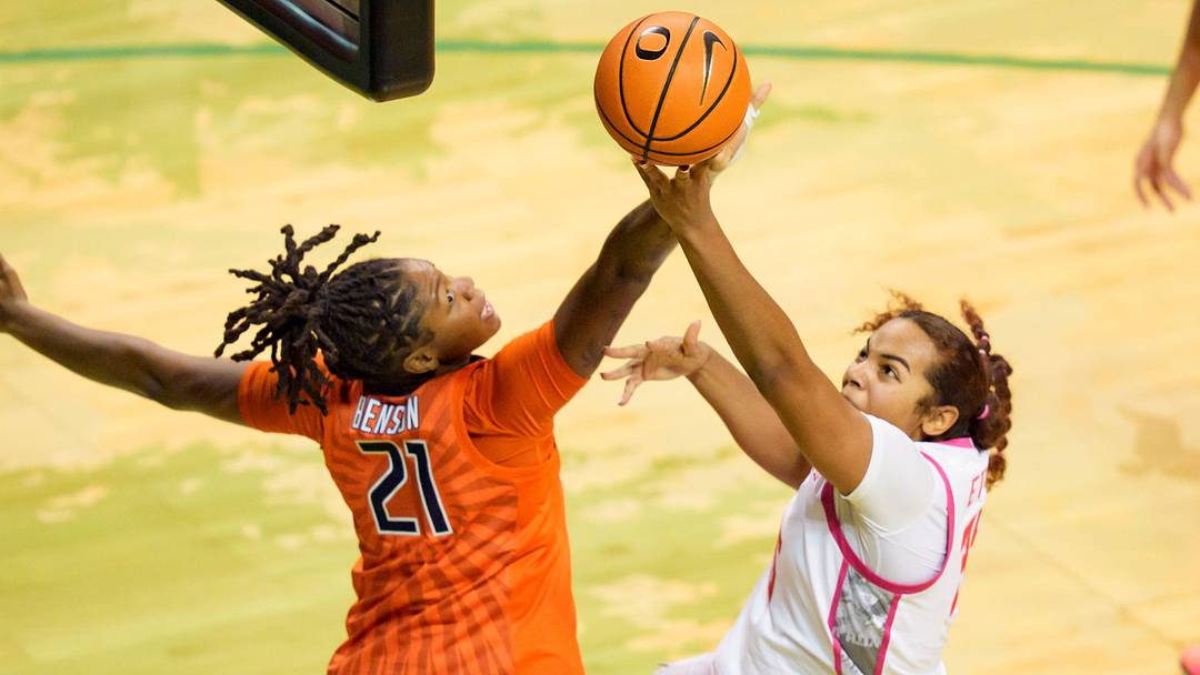 Oregon forward Ehis Etute, right, is fouled by Illinois forward Naomi Benson as the Oregon Ducks host the Illinois Fighting Illini on Feb. 4, 2026, at Matthew Knight Arena in Eugene, Oregon.