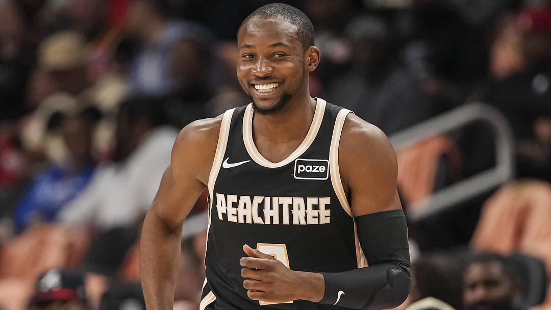 Feb 26, 2026; Atlanta, Georgia, USA; Atlanta Hawks forward Jonathan Kuminga (0) reacts after making a three point shot against the Washington Wizards during the first half at State Farm Arena. Mandatory Credit: Dale Zanine-Imagn Images