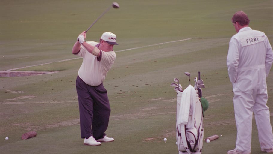  Ed Fiori with his caddy at the practice Tees during the Par 3 Contest at the Augusta National Golf Course. 