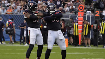 Sep 21, 2025; Chicago, Illinois, USA; Chicago Bears defensive end Montez Sweat (98) and defensive tackle Gervon Dexter Sr. (99) after sacking Dallas Cowboys quarterback Dak Prescott (not pictured) during the second half at Soldier Field. Mandatory Credit: David Banks-Imagn Images
