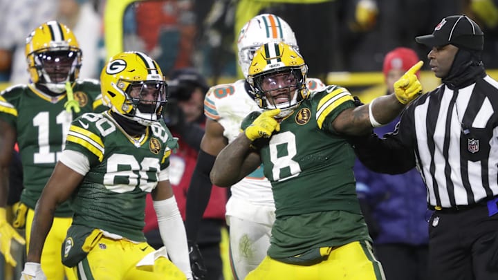 Nov 28, 2024; Green Bay, Wisconsin, USA; Green Bay Packers running back Josh Jacobs (8) celebrates after a long reception and run in the fourth quarter against the Miami Dolphins at Lambeau Field.