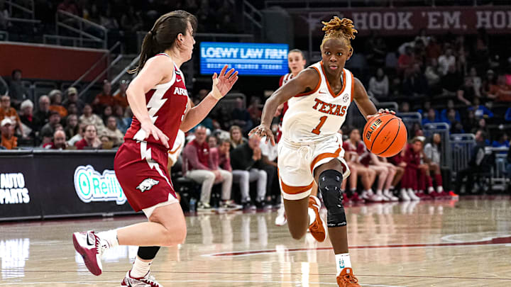 Jan 5, 2025; Austin, Texas, USA; Texas Longhorns guard Bryanna Preston (1) pushes past Arkansas guard Izzy Higgenbottom (3) during the game at Moody Center. Mandatory Credit: Aaron E. Martinez/USA TODAY Network via Imagn Images