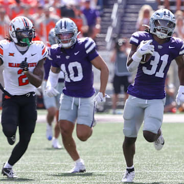 Sep 28, 2024; Manhattan, Kansas, USA; Kansas State Wildcats running back DJ Giddens (31) runs for a 66-yard touchdown against the Oklahoma State Cowboys in the third quarter at Bill Snyder Family Football Stadium. Mandatory Credit: Scott Sewell-Imagn Images