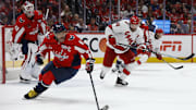 May 6, 2025; Washington, District of Columbia, USA; Washington Capitals left wing Alex Ovechkin (8) controls the puck in front of Capitals goaltender Logan Thompson (48) as Carolina Hurricanes left wing Jordan Martinook (48) chases in the second period in game one of the second round of the 2025 Stanley Cup Playoffs at Capital One Arena. Mandatory Credit: Geoff Burke-Imagn Images