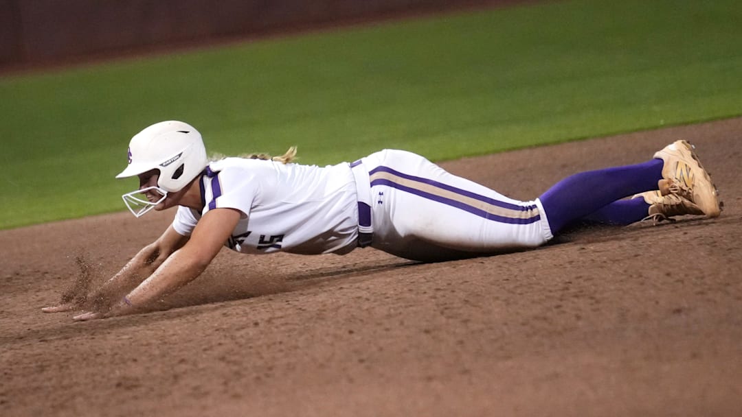 Queen Creek Bulldogs' base runner Emma Reynolds (15) slides safely into third against the Xavier Prep Gators during their AIA 6A State Championship game at ASU Farrington Softball Stadium in Tempe on May 19, 2025.