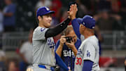 Shohei Ohtani and Dave Roberts after the Dodgers' 9–0 win over the Braves on Sept. 16, 2024.