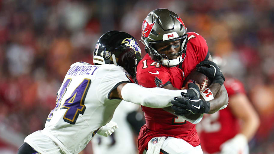 Tampa Bay Buccaneers wide receiver Chris Godwin is pressured by Baltimore Ravens cornerback Marlon Humphrey. | Nathan Ray Seebeck-Imagn Images