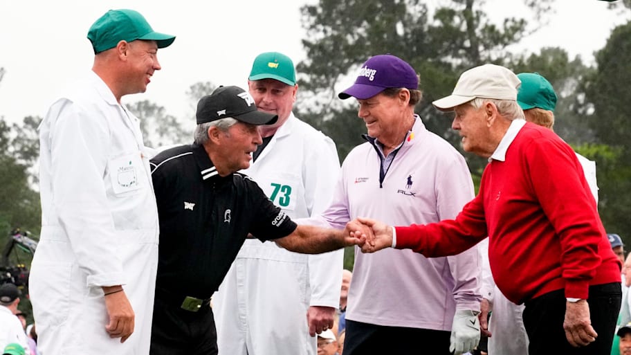 Honorary starters Gary Player, Tom Watson and Jack Nicklaus shake hands on the first tee at the 2023 Masters