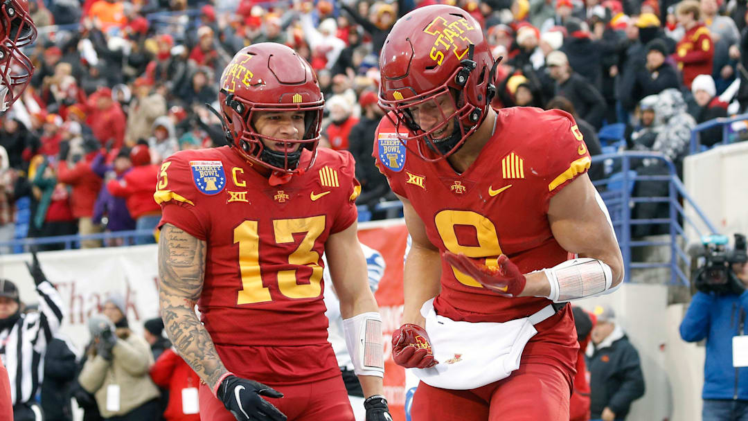 Dec 29, 2023; Memphis, TN, USA; Iowa State Cyclones wide receiver Jaylin Noel (13) and wide receiver Jayden Higgins (9) react after a touchdown during the first half against the Memphis Tigers at Simmons Bank Liberty Stadium. Mandatory Credit: Petre Thomas-Imagn Images