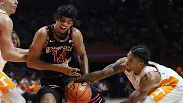 Jan 15, 2025; Knoxville, Tennessee, USA; Tennessee Volunteers guard Zakai Zeigler (5) steals the ball from Georgia Bulldogs forward Asa Newell (14) during the second half at Thompson-Boling Arena at Food City Center. Mandatory Credit: Randy Sartin-Imagn Images