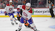 Mar 27, 2025; Philadelphia, Pennsylvania, USA; Montreal Canadiens defenseman Lane Hutson (48) clears the puck against the Philadelphia Flyers during the first period at Wells Fargo Center. Mandatory Credit: Eric Hartline-Imagn Images