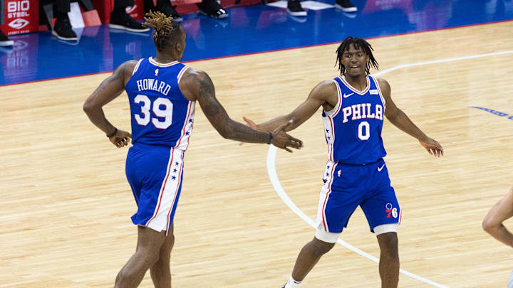 Jun 2, 2021; Philadelphia, Pennsylvania, USA; Philadelphia 76ers guard Tyrese Maxey (0) and center Dwight Howard (39) celebrate a score against the Washington Wizards during the first quarter in game five of the first round of the 2021 NBA Playoffs at Wells Fargo Center. Mandatory Credit: Bill Streicher-Imagn Images