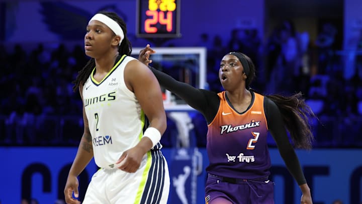 Jul 3, 2025; Arlington, Texas, USA;  Phoenix Mercury guard Kahleah Copper (2) reacts in front of Dallas Wings forward Myisha Hines-Allen (2) after scoring during the second half at College Park Center. Mandatory Credit: Kevin Jairaj-Imagn Images