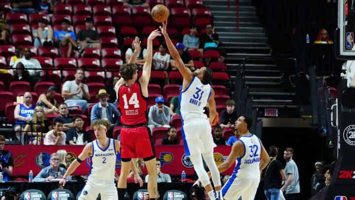 Jul 14, 2024; Las Vegas, NV, USA; Golden State Warriors forward Kevin Knox II (31) blocks a shot by Chicago Bulls forward Matas Buzelis (14): Stephen R. Sylvanie-USA TODAY Sports