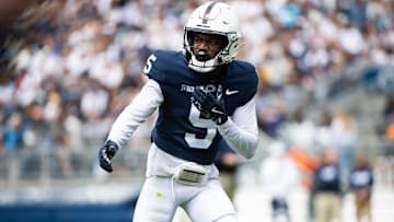 Penn State football wide receiver Devonte Ross checks with the line judge during the Blue-White game at Beaver Stadium