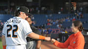 Akron RubberDucks assistant athletic trainer Karina Gonzalez gets a first bump from Chase DeLauter before the game against Erie on Tuesday, April 16, 2024, in Akron, Ohio. [Phil Masturzo/ Beacon Journal]