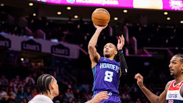 Mar 1, 2025; Charlotte, North Carolina, USA; Charlotte Hornets guard Nick Smith Jr. (8) shoots against the Washington Wizards during the first quarter at Spectrum Center. Mandatory Credit: Scott Kinser-Imagn Images