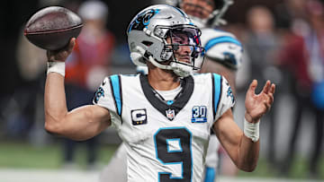 Jan 5, 2025; Atlanta, Georgia, USA; Carolina Panthers quarterback Bryce Young (9) passes on the run against the Atlanta Falcons during the second half at Mercedes-Benz Stadium. Mandatory Credit: Dale Zanine-Imagn Images