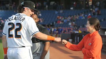 Akron RubberDucks assistant athletic trainer Karina Gonzalez gets a first bump from Chase DeLauter before the game against Erie on Tuesday, April 16, 2024, in Akron, Ohio. [Phil Masturzo/ Beacon Journal]