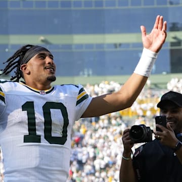 Green Bay Packers quarterback Jordan Love celebrates as he runs off the field following the game against the Houston Texans.