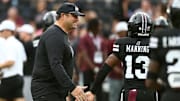 Mississippi State Bulldogs head coach Jeff Lebby reacts with defensive back Jahron Manning (13) during warm ups prior to the game against the Arizona State Sun Devils at Davis Wade Stadium at Scott Field.