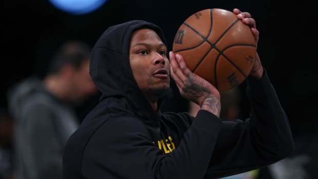 Mar 31, 2024; Brooklyn, New York, USA; Los Angeles Lakers forward Cam Reddish (5) warms up before