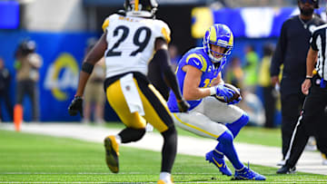 Oct 22, 2023; Inglewood, California, USA; Los Angeles Rams wide receiver Cooper Kupp (10) runs the ball against Pittsburgh Steelers cornerback Levi Wallace (29) during the first half at SoFi Stadium. Mandatory Credit: Gary A. Vasquez-Imagn Images