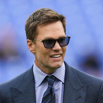 Oct 12, 2025; Baltimore, Maryland, USA; Fox Sports announcer Tom Brady looks on before the game between the Baltimore Ravens and the Los Angeles Rams at M&T Bank Stadium. Mandatory Credit: Mitch Stringer-Imagn Images