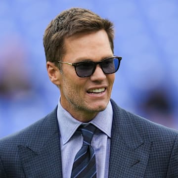 Oct 12, 2025; Baltimore, Maryland, USA; Fox Sports announcer Tom Brady looks on before the game between the Baltimore Ravens and the Los Angeles Rams at M&T Bank Stadium. Mandatory Credit: Mitch Stringer-Imagn Images