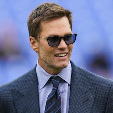Oct 12, 2025; Baltimore, Maryland, USA; Fox Sports announcer Tom Brady looks on before the game between the Baltimore Ravens and the Los Angeles Rams at M&T Bank Stadium.