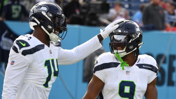 Dec 24, 2023; Nashville, Tennessee, USA; Seattle Seahawks wide receiver DK Metcalf (14) and running back Kenneth Walker III (9) before the game against the Tennessee Titans at Nissan Stadium. Mandatory Credit: Christopher Hanewinckel-USA TODAY Sports