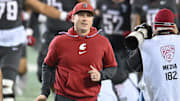 Nov 9, 2024; Pullman, Washington, USA; Washington State Cougars head coach Jake Dickert runs onto the field before a game against the Utah State Aggies at Gesa Field at Martin Stadium. Mandatory Credit: James Snook-Imagn Images
