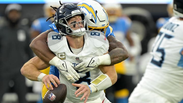 Nov 10, 2024; Inglewood, California, USA;  Tennessee Titans quarterback Will Levis (8) is sacked by Los Angeles Chargers linebacker Bud Dupree (48) in the second half at SoFi Stadium. Mandatory Credit: Jayne Kamin-Oncea-Imagn Images