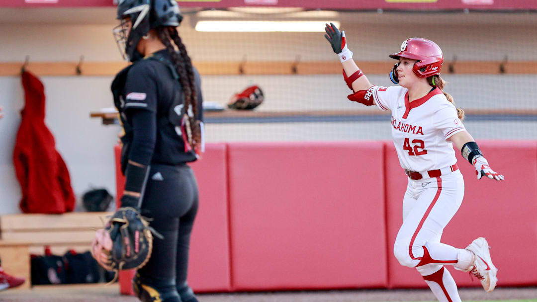 Oklahoma shortstop Gabbie Garcia airplanes home after hitting a home run. Oklahoma shortstop Gabbie Garcia airplanes home after hitting a home run.