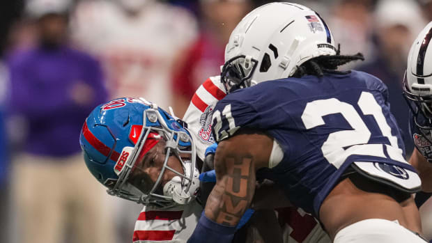 Penn State safety KJ Winston tackles Ole Miss running back Quinshon Judkins during the 2023 Peach Bowl.