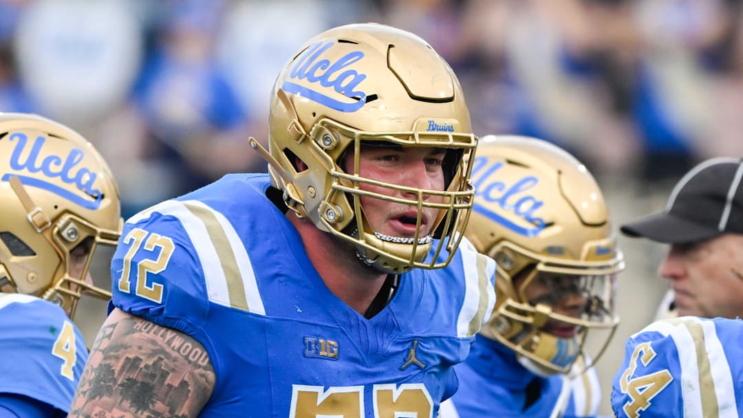 Nov 30, 2024; Pasadena, California, USA; UCLA Bruins offensive linemen Garrett DiGiorgio (72) and Josh Carlin (54) during the second quarter against the Fresno State Bulldogs at Rose Bowl. Mandatory Credit: Robert Hanashiro-Imagn Images