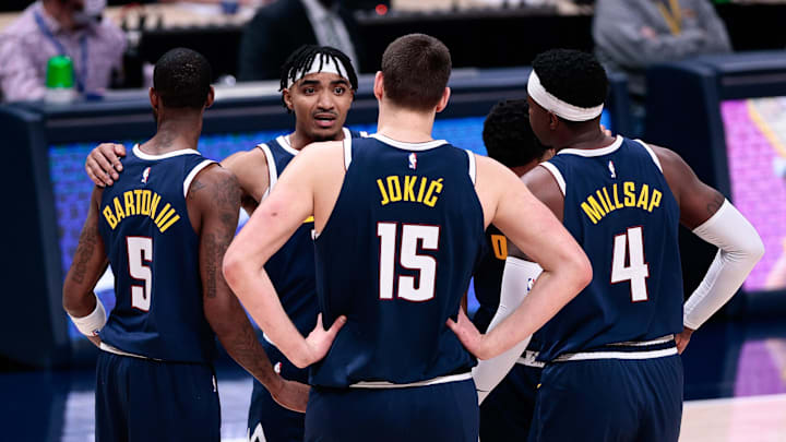 Dec 23, 2020; Denver, Colorado, USA; Denver Nuggets guard Gary Harris (14) with forward Will Barton (5) and center Nikola Jokic (15) and forward Paul Millsap (4) and guard PJ Dozier (35) during a timeout in the fourth quarter against the Sacramento Kings at Ball Arena. Mandatory Credit: Isaiah J. Downing-Imagn Images